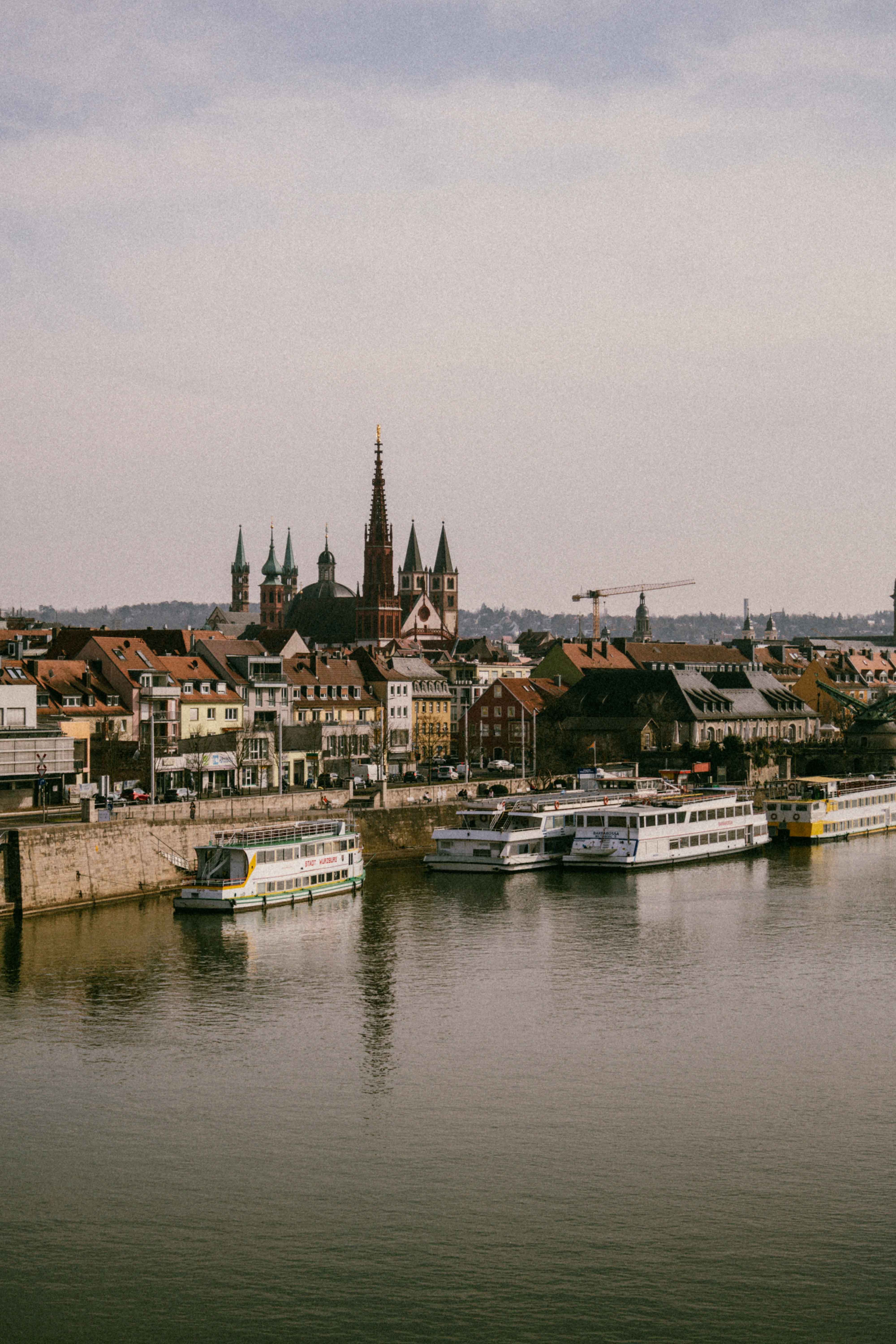 Scenic Riverside View of Historic European City · Free Stock Photo