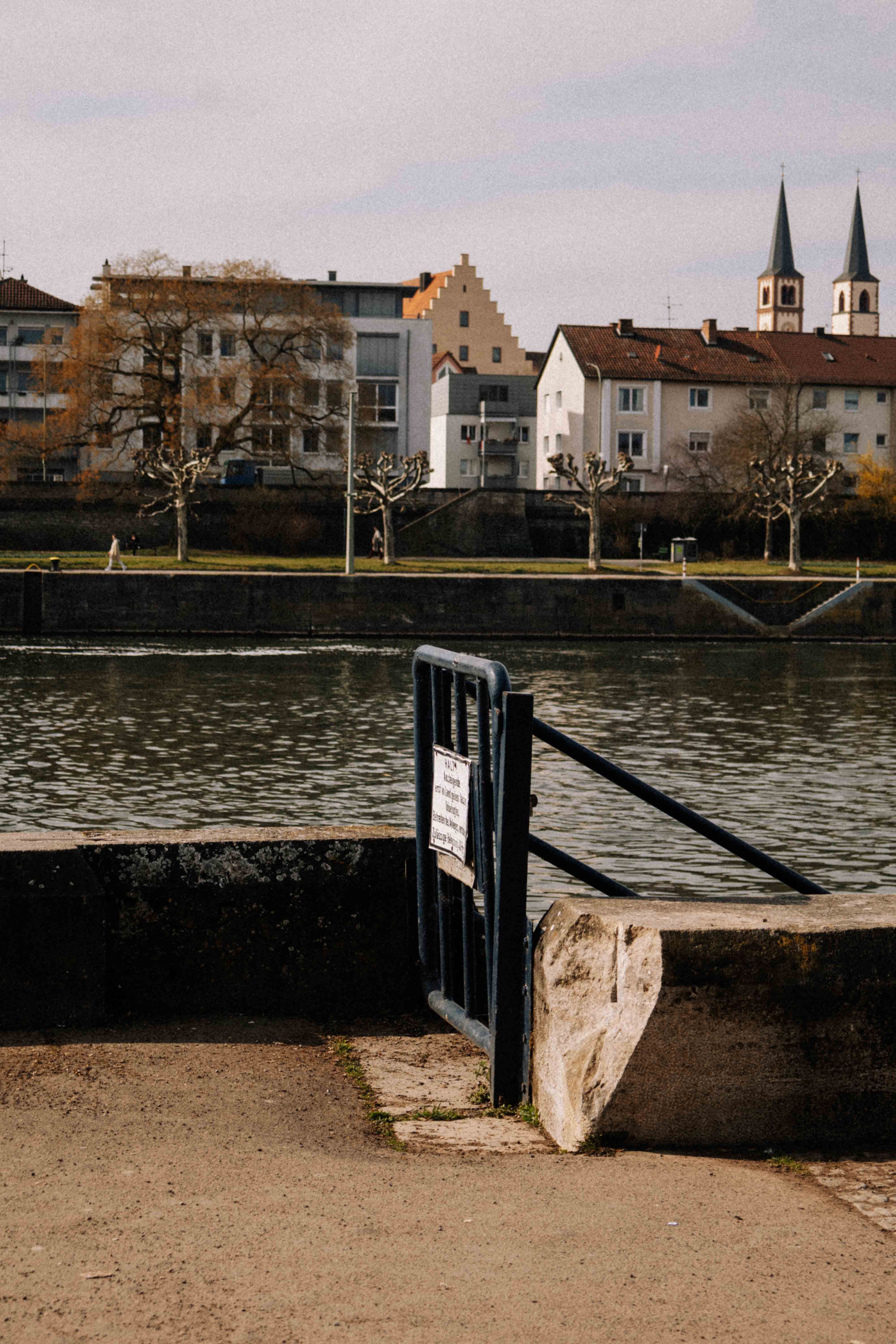Scenic Riverside View with Historic Architecture · Free Stock Photo