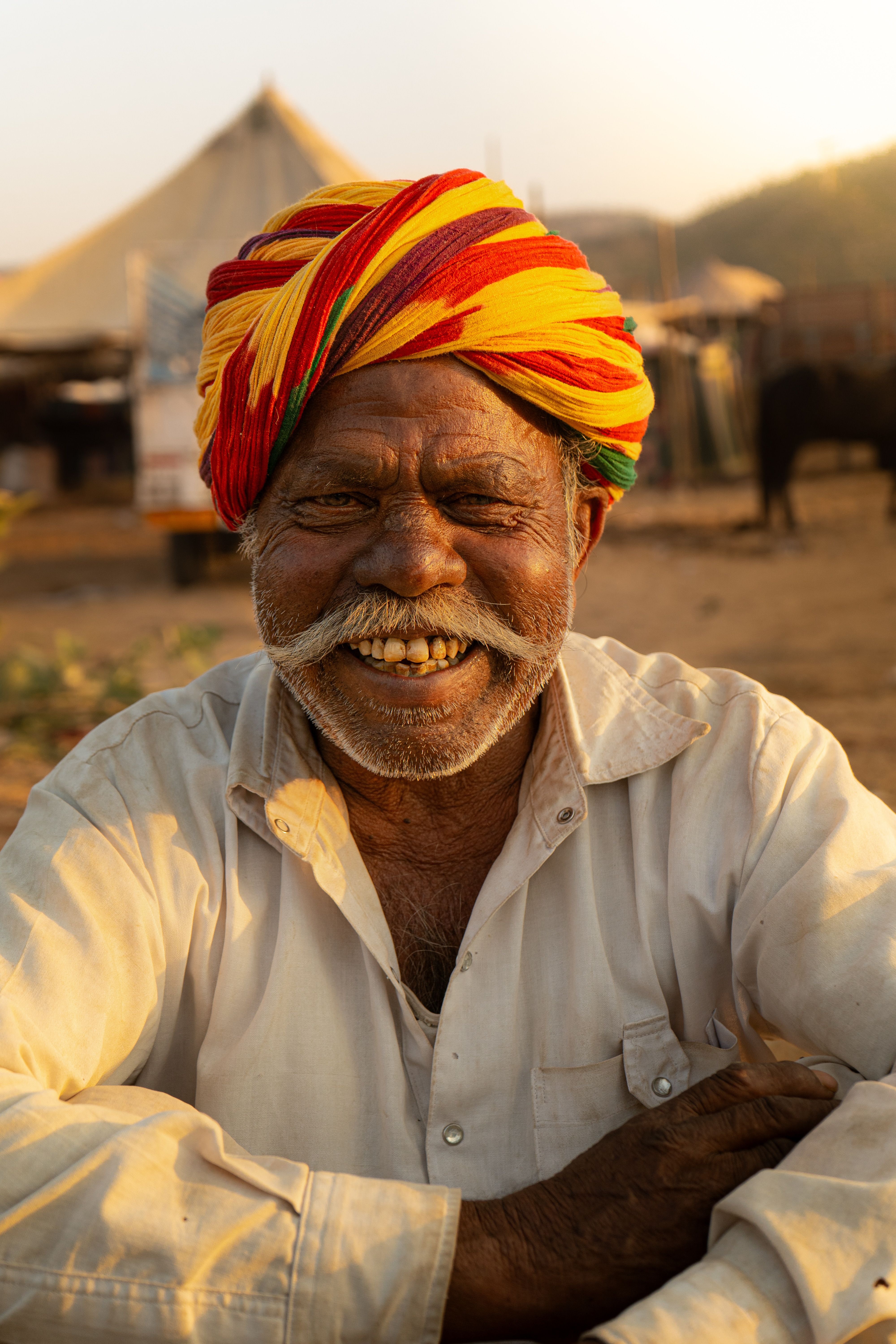 Smiling Elderly Man in Colorful Traditional Turban · Free Stock Photo