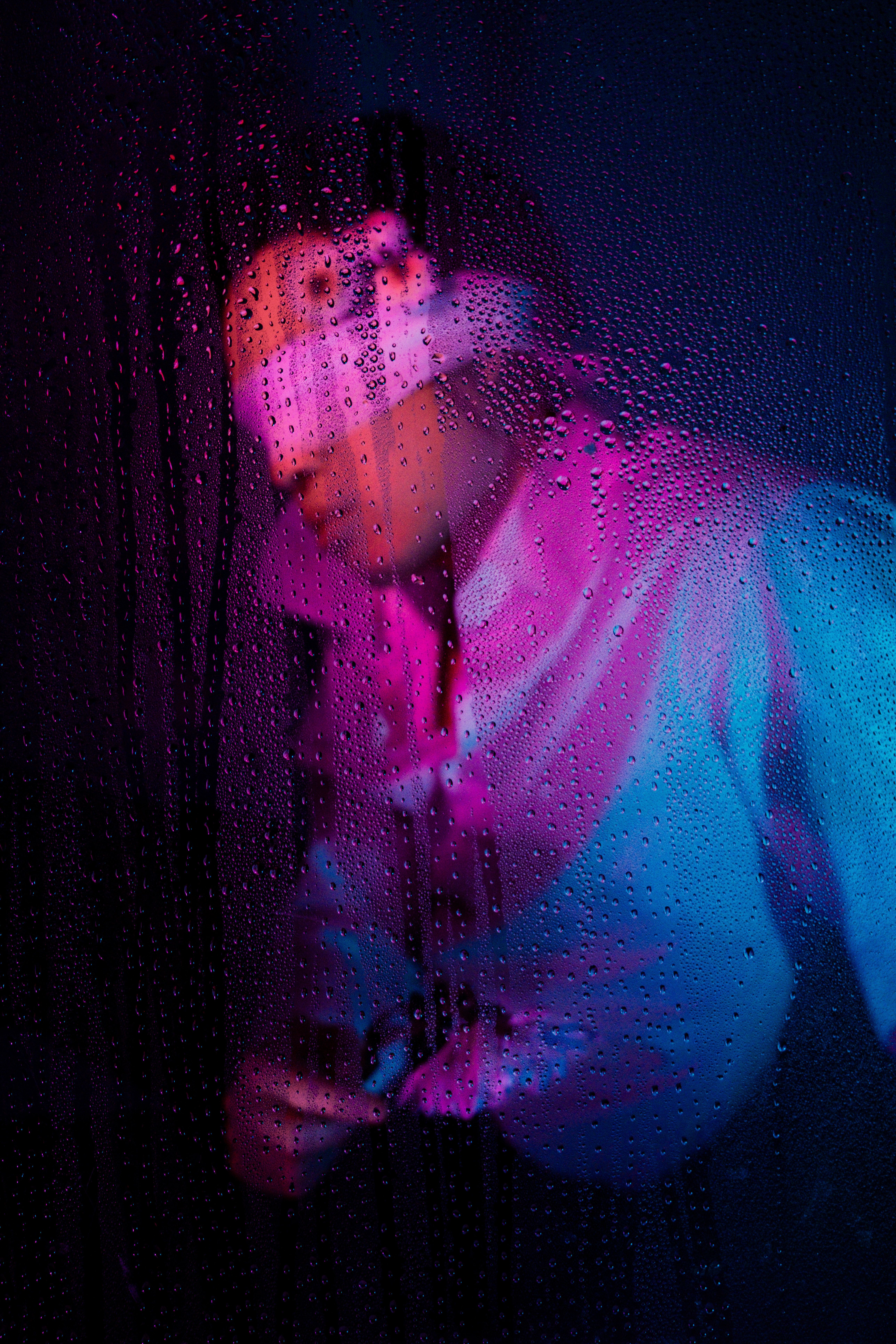 Creative Studio Portrait with Purple Lighting · Free Stock Photo
