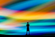 Silhouette Against Vivid Abstract Burst