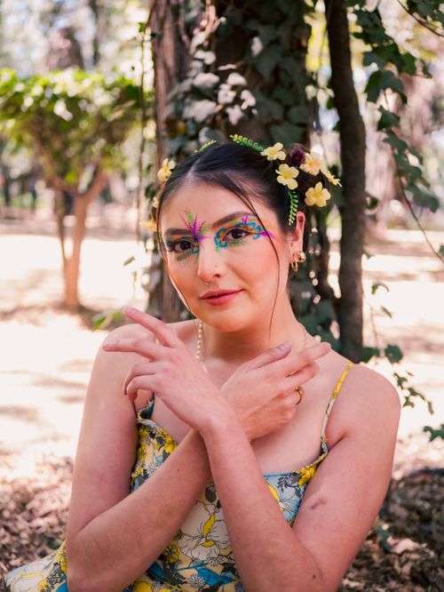 Free Vibrant portrait of a woman with floral face paint in Chapultepec Park, Mexico City. Stock Photo