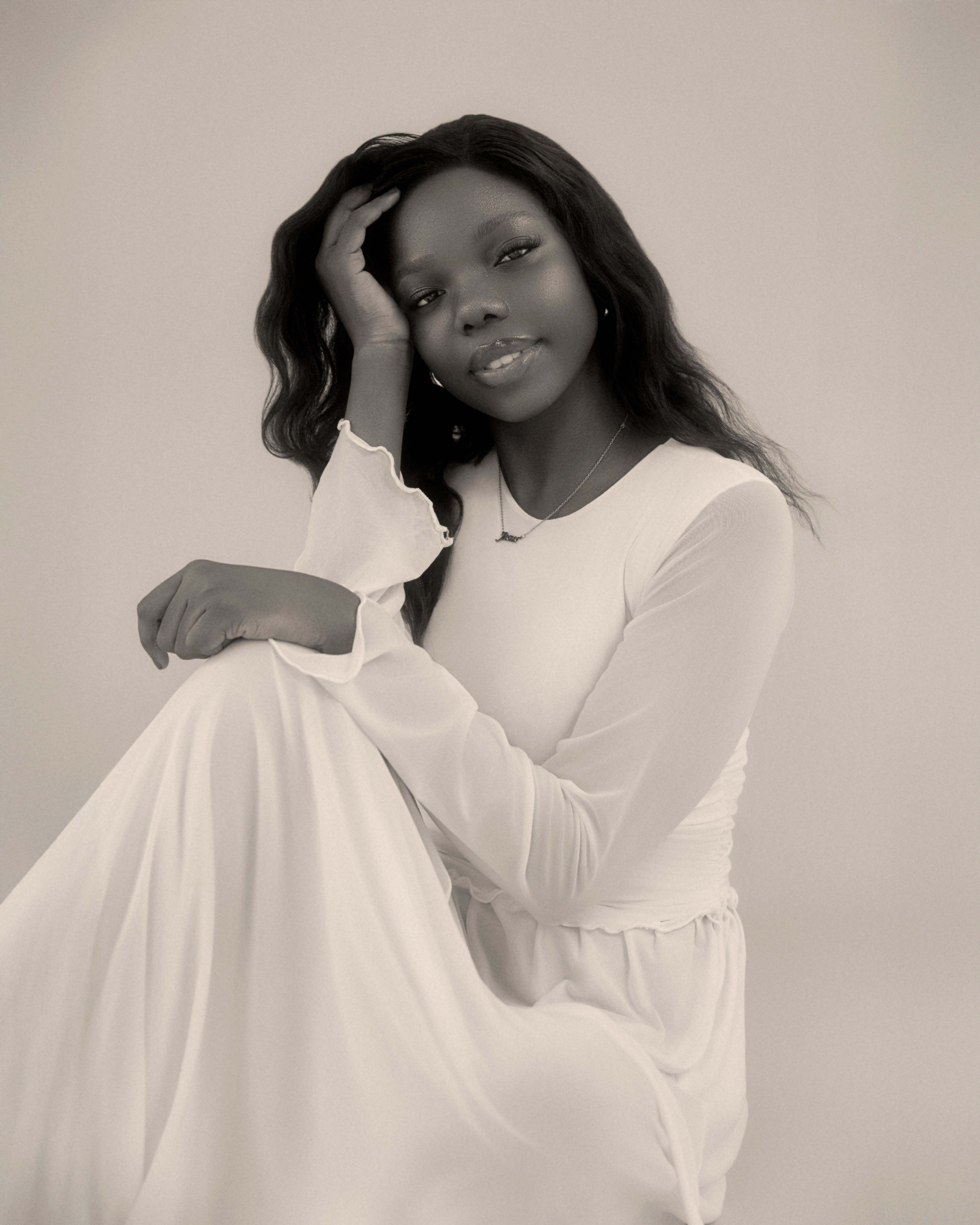 Elegant Portrait of a Woman in White Dress · Free Stock Photo