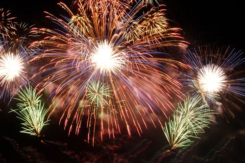 Free Vibrant fireworks explode against a night sky, showcasing a stunning visual spectacle. Stock Photo