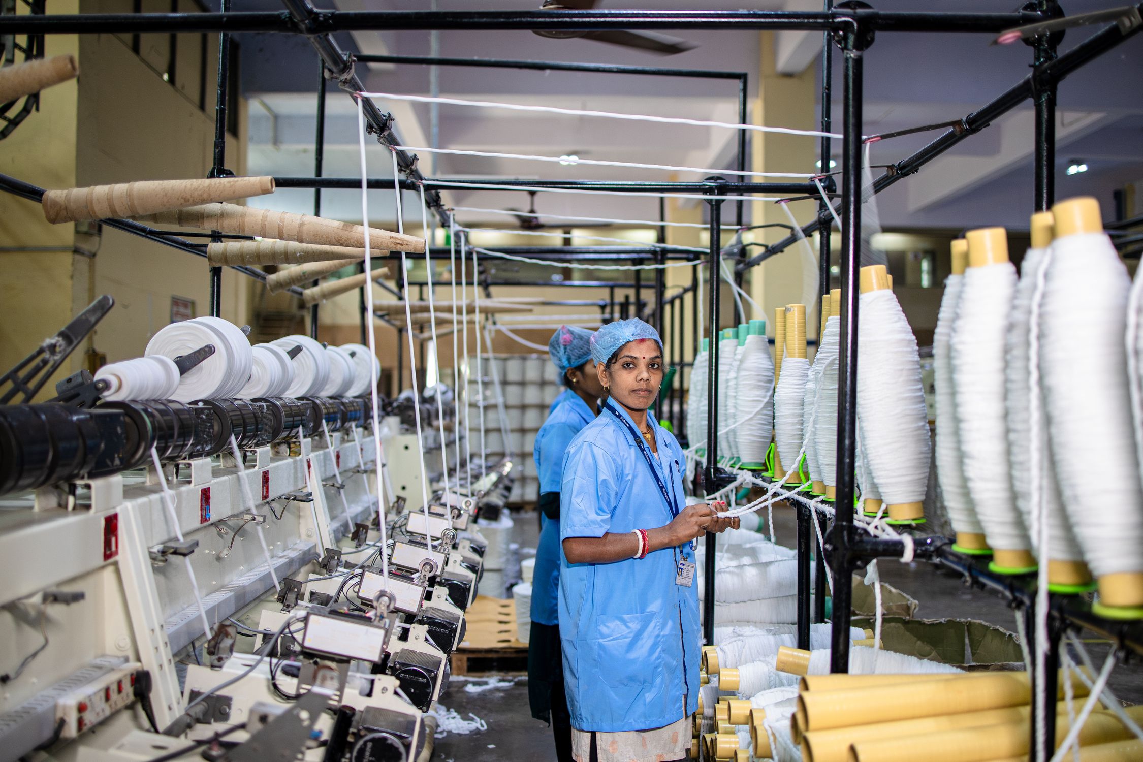 Indian Textile Factory Workers Operating Machinery · Free Stock Photo
