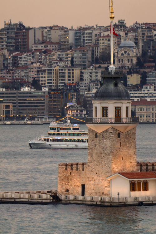 Free Beautiful view of the Maiden's Tower with Istanbul skyline at dusk. Stock Photo
