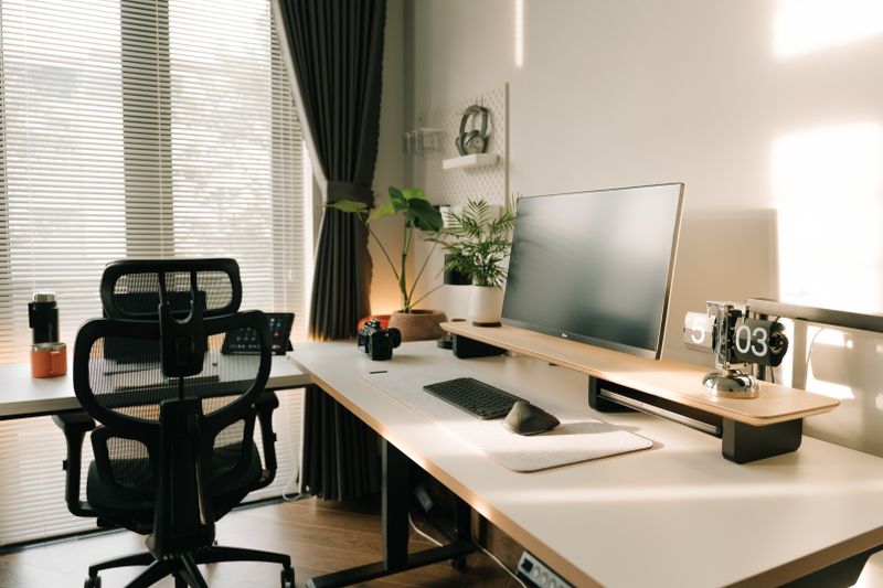 small floating shelf mounted above a desktop monitor