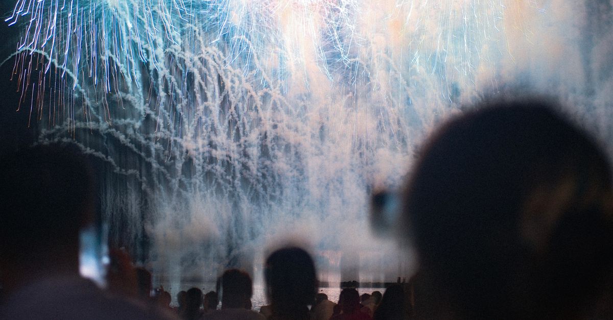 rocket launch spectators watching night sky Florida coast