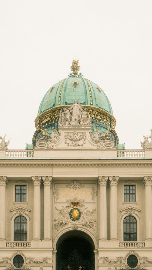 Free Elegant domed structure of the Hofburg Palace with intricate architecture in Vienna. Stock Photo