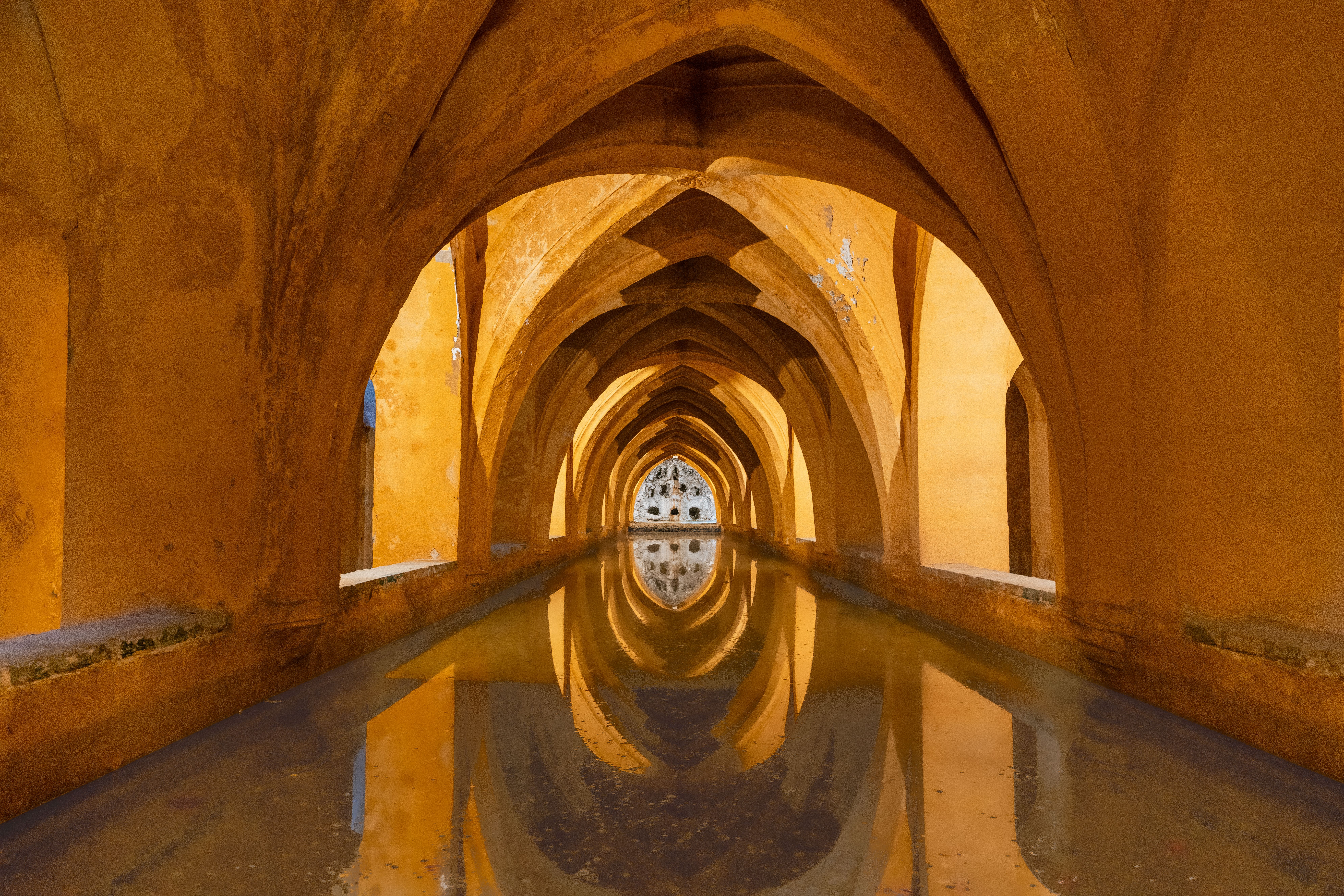 Reflective arches in the Baths of Maria de Padilla, Alcázar of Sevilla.