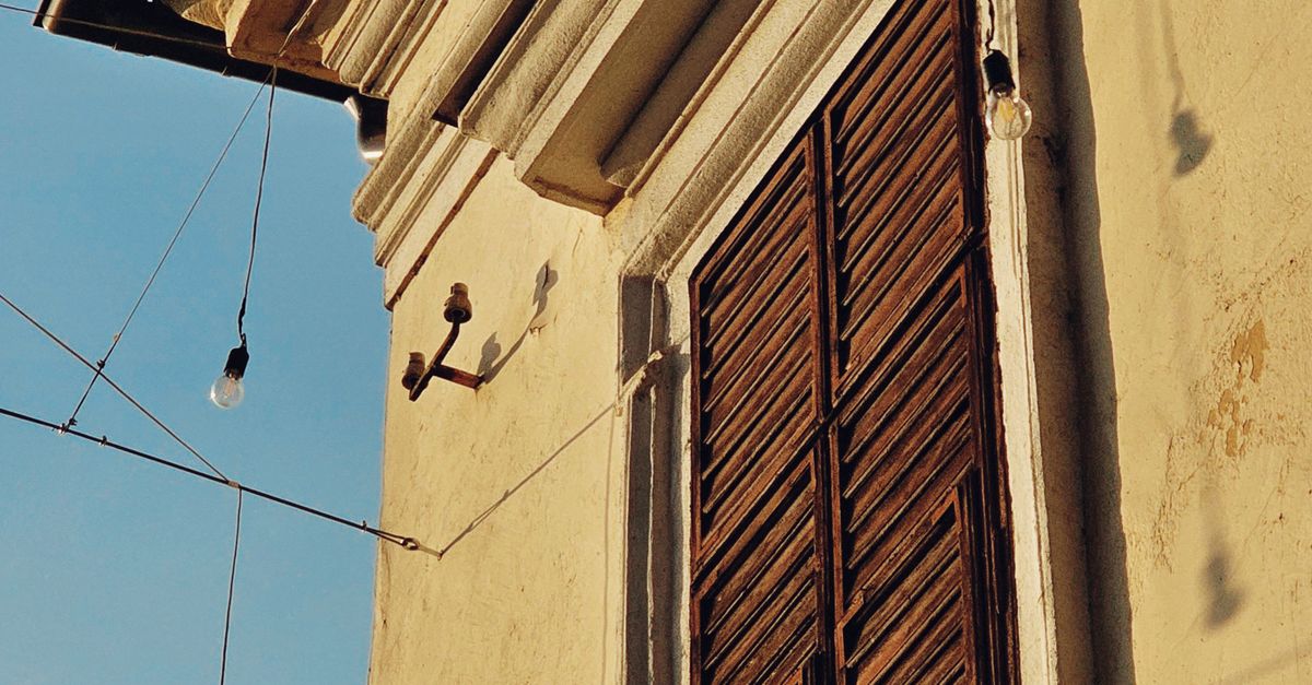 Building With String Vintage Building Facade with String Lights · Free Stock Photo