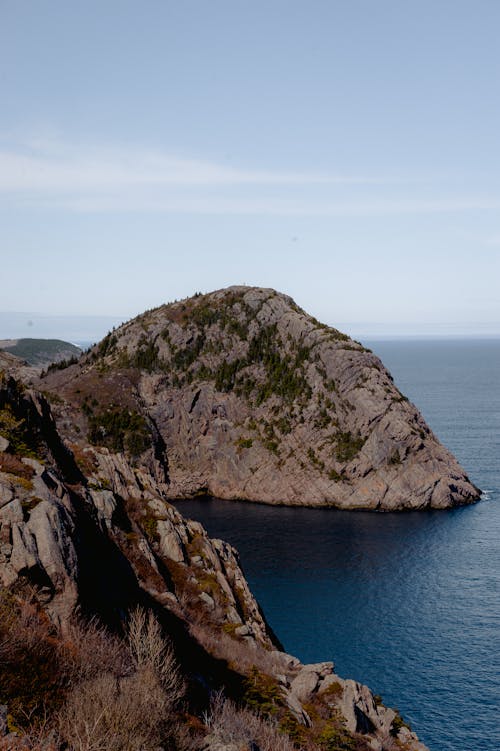 Body of Water Beside Rock Formation