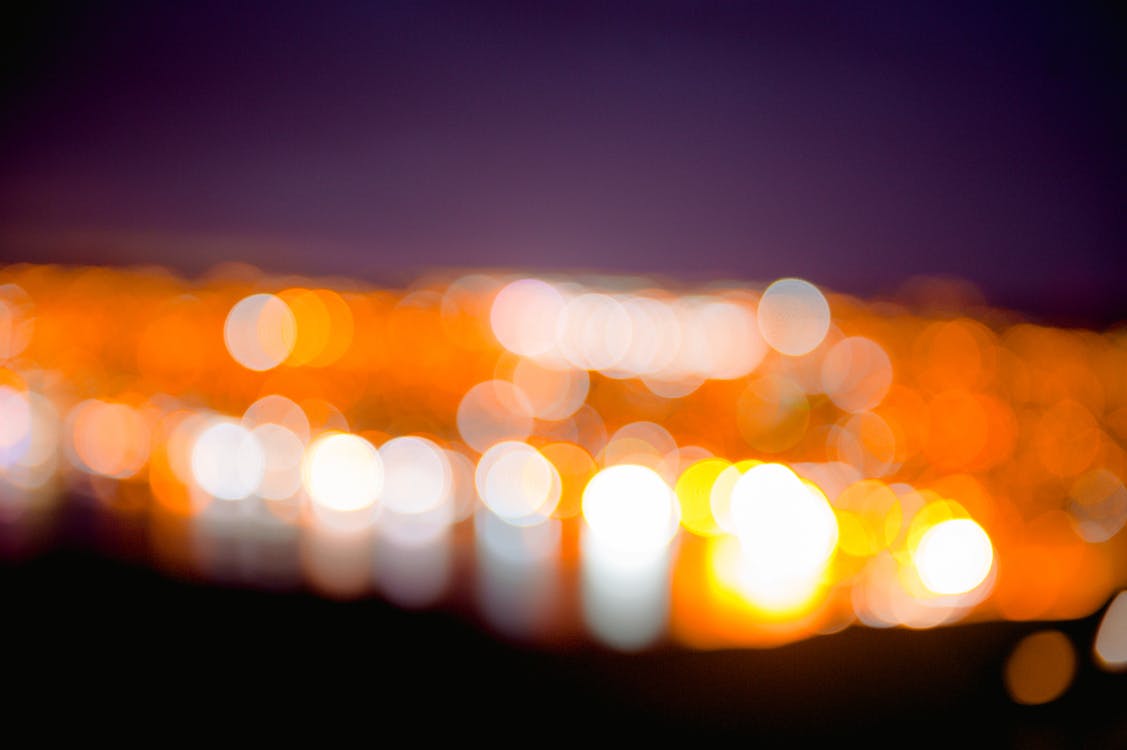 Bokeh Photography of White and Orange Lights