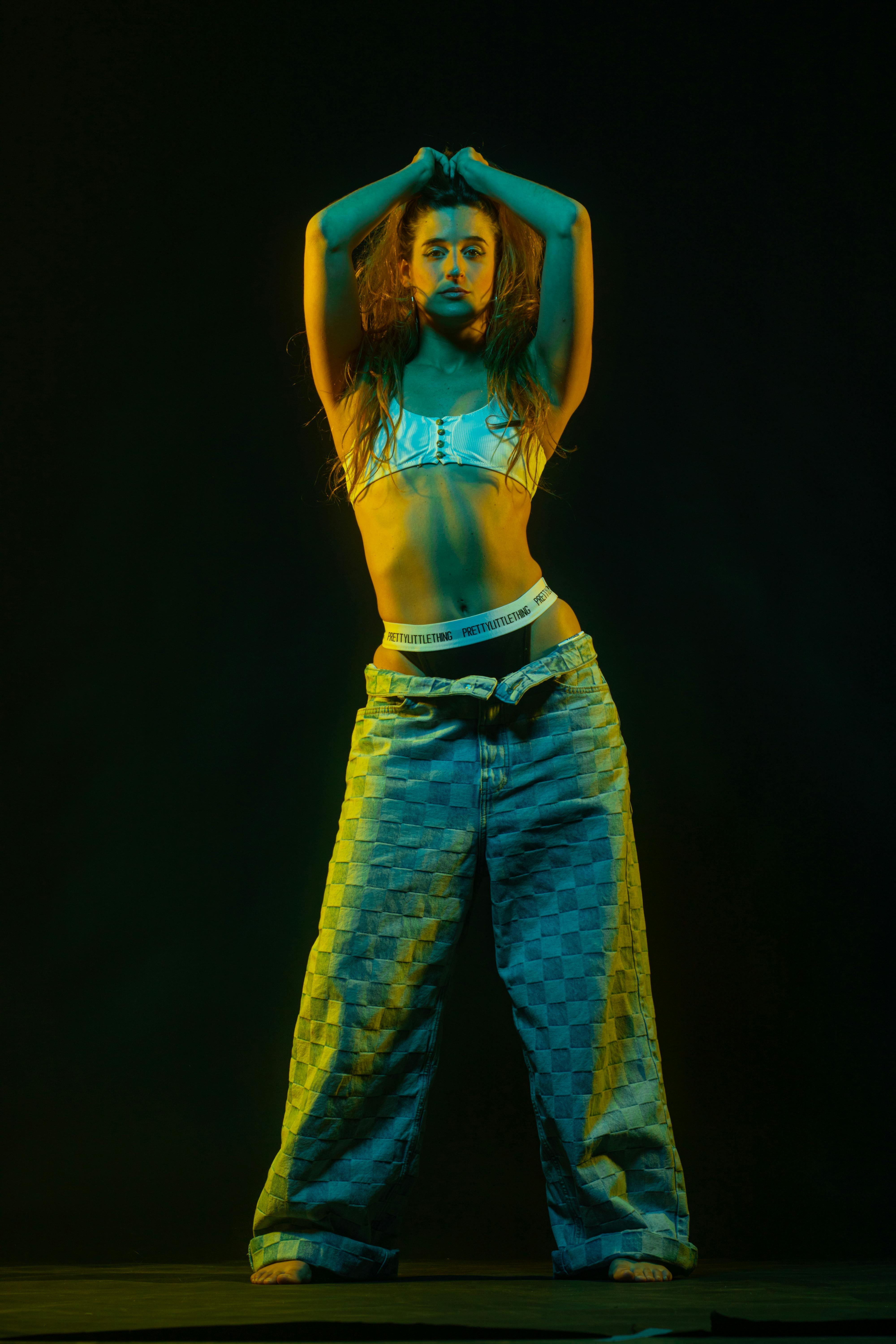 Dynamic Portrait in Blue and Yellow Studio Lighting · Free Stock Photo