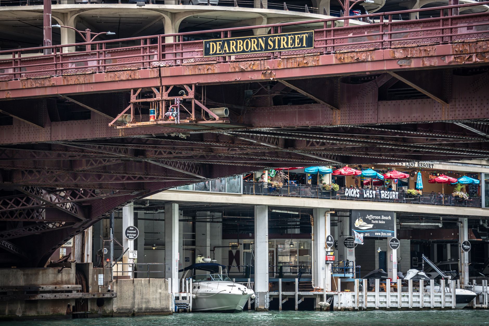 View of Dearborn Street Bridge in Chicago over the river with boat dock area.