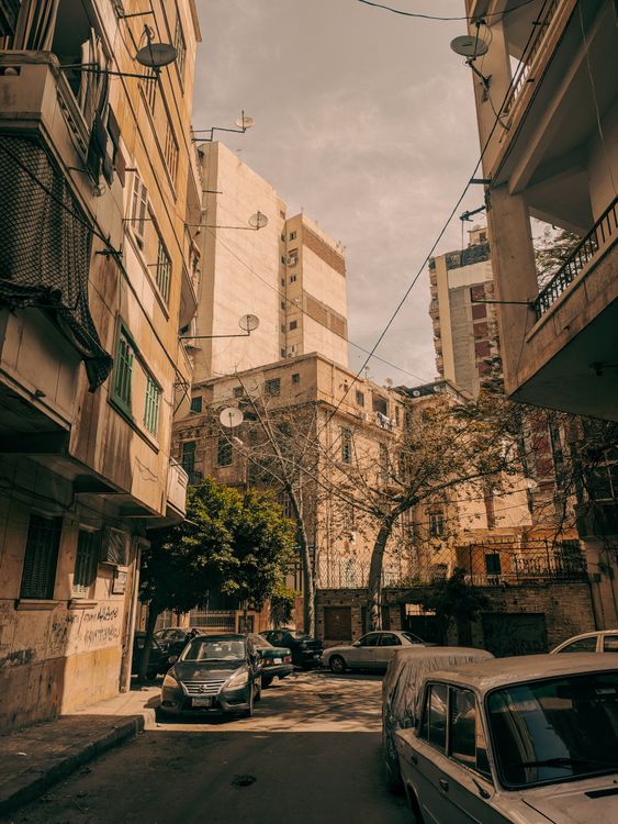 Urban Street Scene with Cars and Buildings · Free Stock Photo