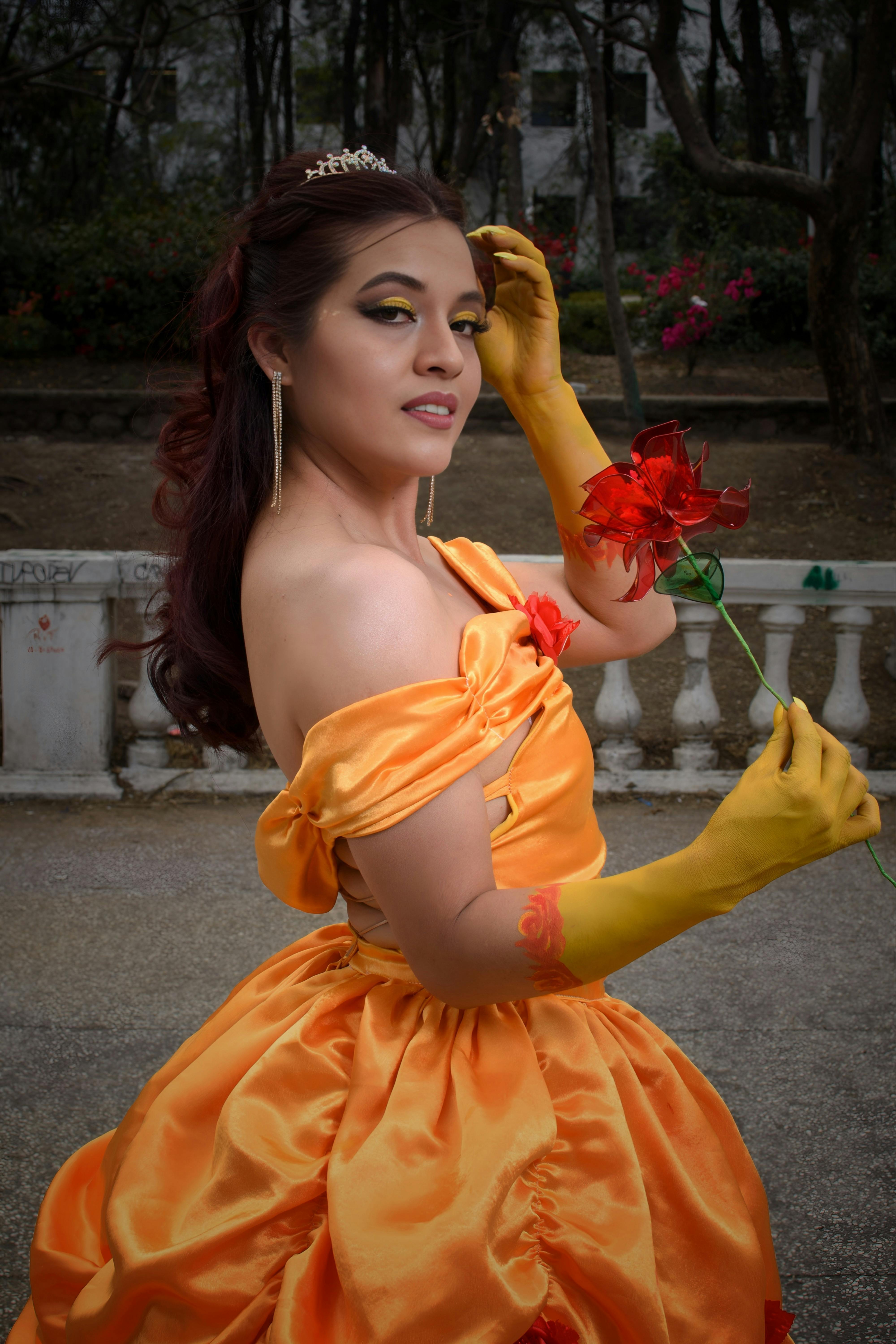 Young actors in colorful Beauty and the Beast Jr costumes on stage