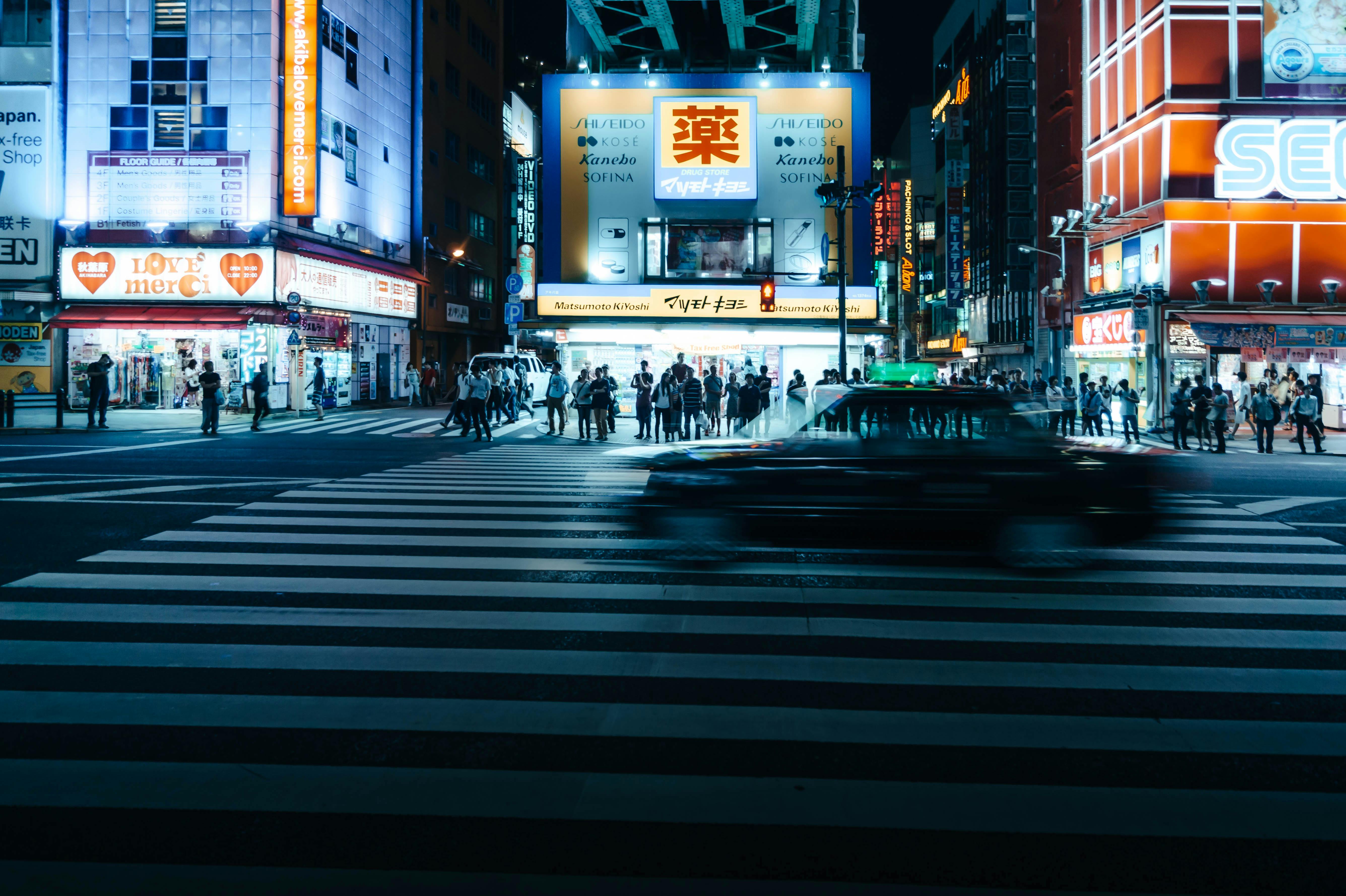 Vibrant street scene at Shinjuku, Tokyo, capturing nightlife and city hustle.