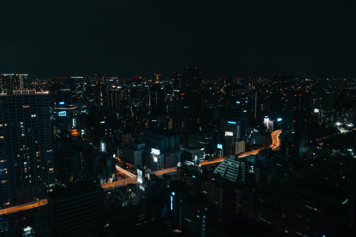 Aerial night view of Tokyo city lights and skyscrapers seen from the Roppongi Hills observation deck