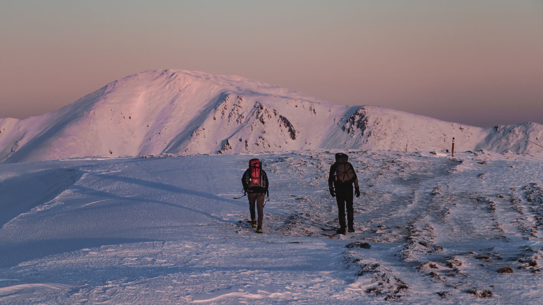 Hikers on rocky trail approaching Cherni Vrah summit on Vitosha mountain