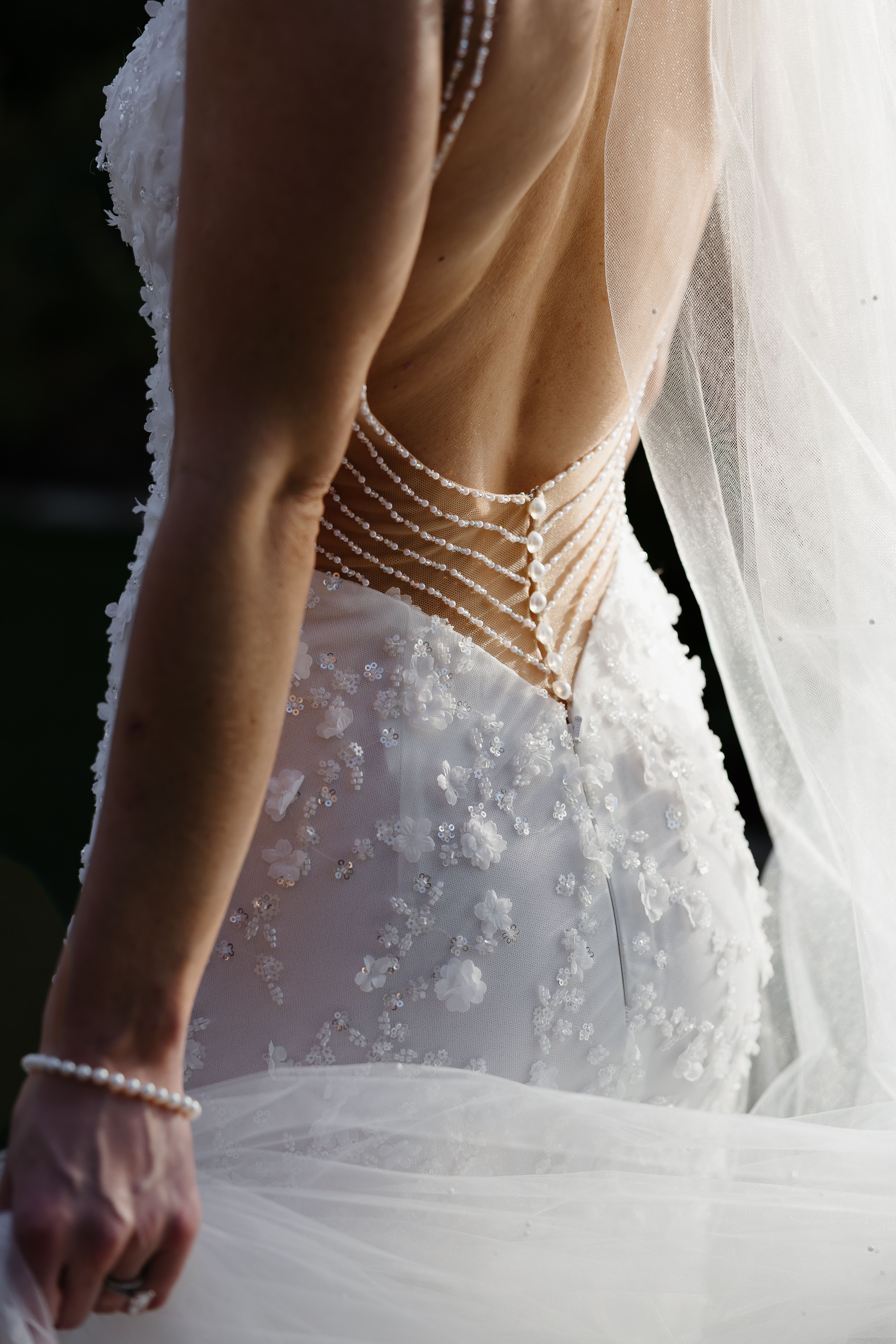 Elegant Wedding Gown with Intricate Back Design · Free Stock Photo