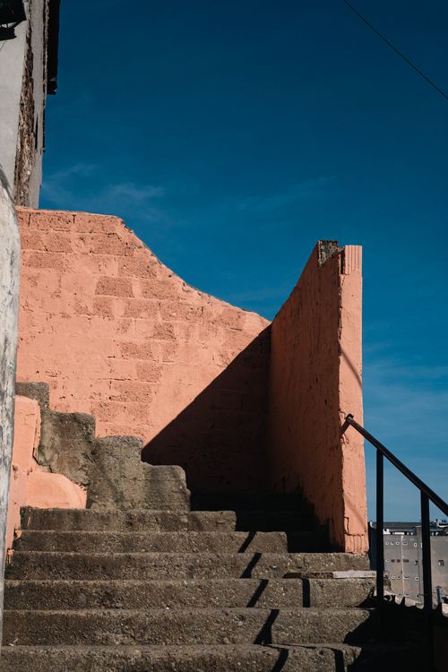 Shadow across concrete stairs, photo by Eyupcan Timur on Pexels
