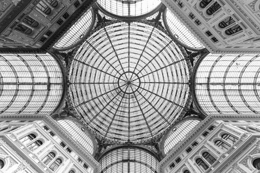 Captivating view of the glass dome ceiling of Galleria Umberto I in Naples, Italy.