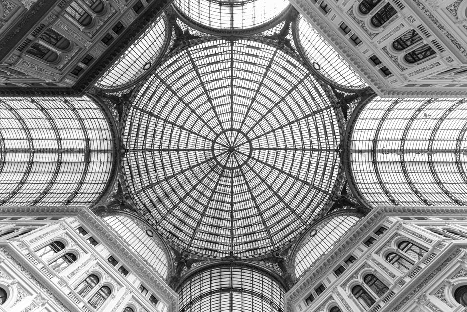 Captivating view of the glass dome ceiling of Galleria Umberto I in Naples, Italy.
