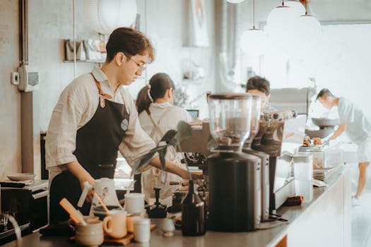 Barista in a coffee shop preparing espresso, creating a cozy atmosphere.