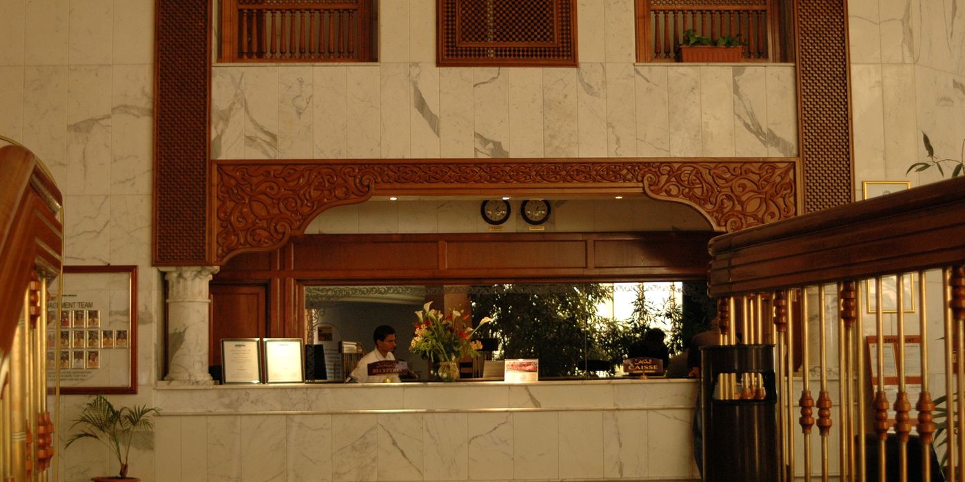 A marble hotel reception area, representing hotel loyalty programs and point devaluation in 2026