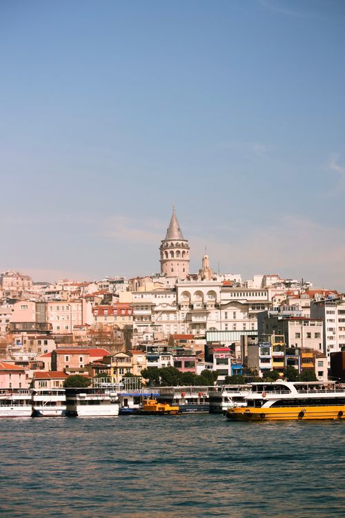 Free A serene view of the Galata Tower amidst historic Istanbul architecture and waterfront. Stock Photo