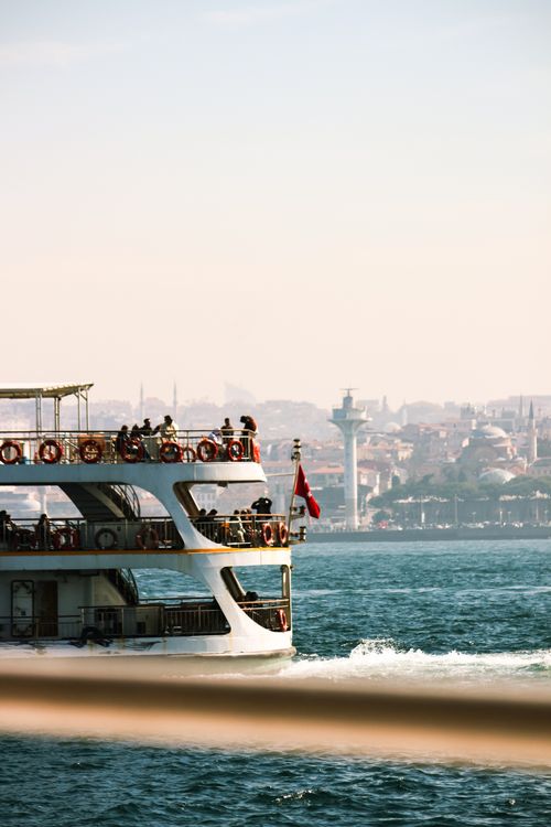 Free A picturesque ferry crossing the Bosphorus with Istanbul skyline in the background. Stock Photo