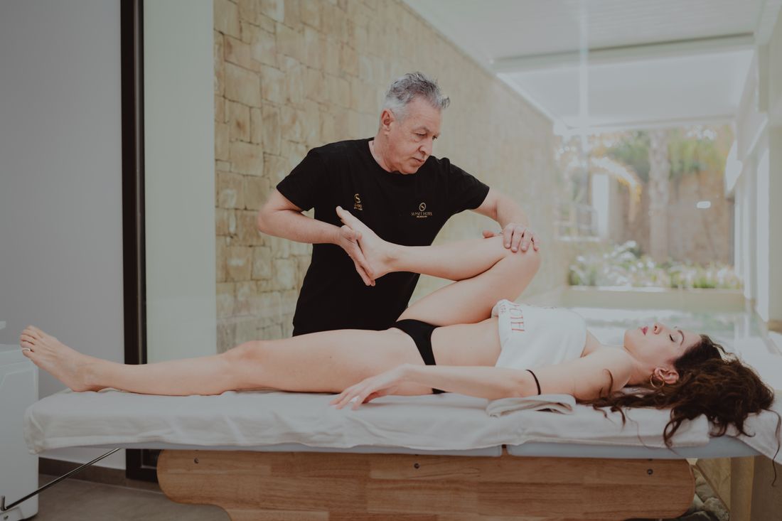 Therapist assisting a patient during rehabilitation
