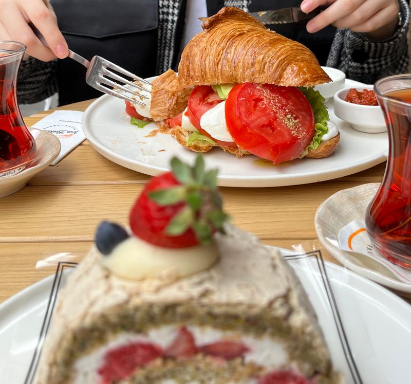 Croissant sandwich and cake served at the café