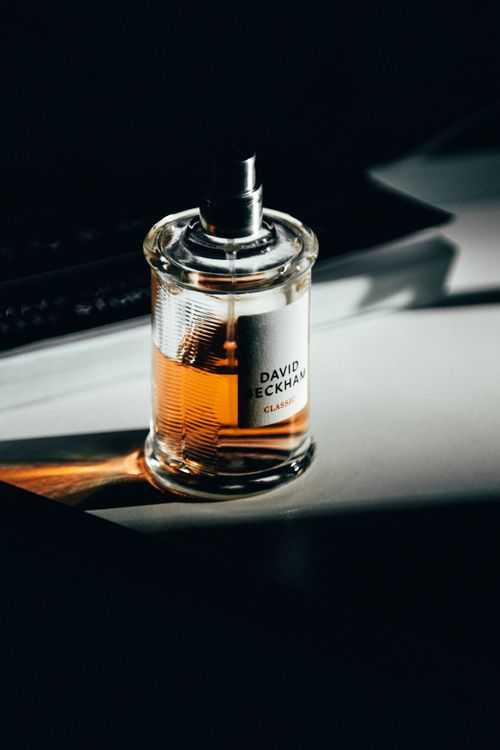 Free Elegant product photography of a luxury perfume bottle with dramatic lighting. Stock Photo