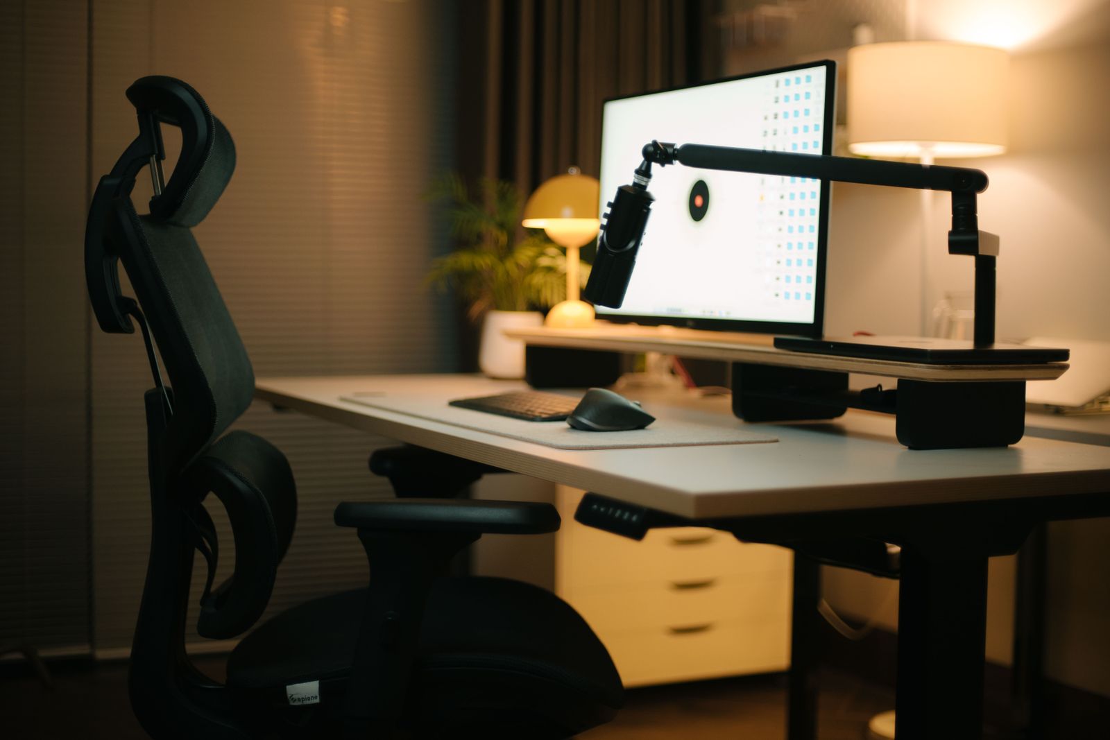 Warm contemporary home office with ergonomic seating and a refined desk setup