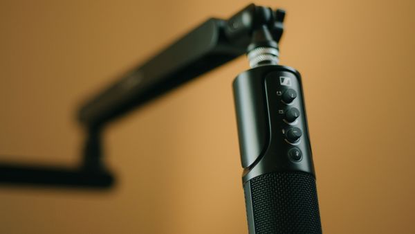A professional microphone on an adjustable arm stand