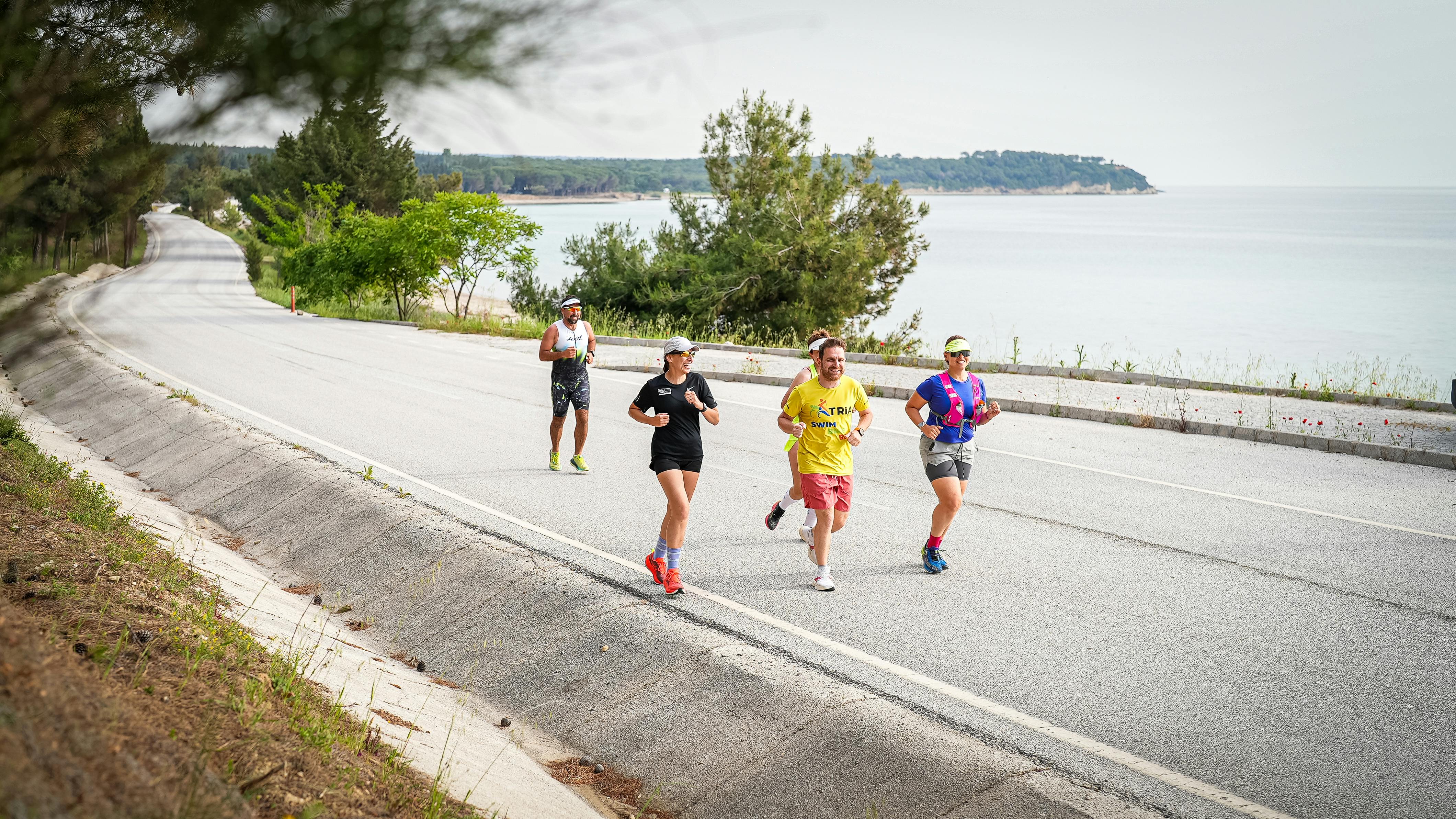 Group of runners enjoying a scenic coastal route in Gelibolu, Türkiye.