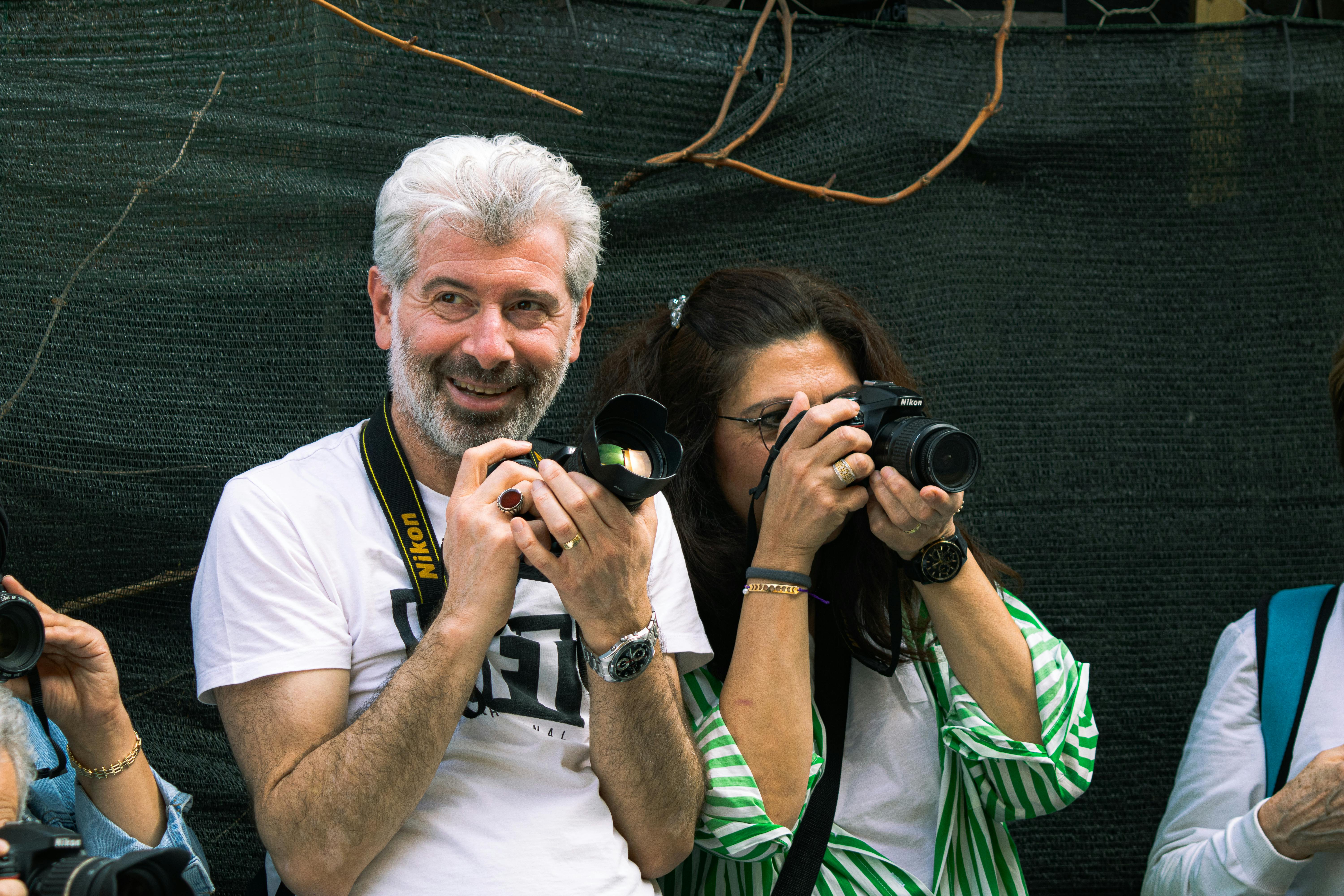 Group of amateur photographers capturing outdoor scenes in Bursa, Türkiye.