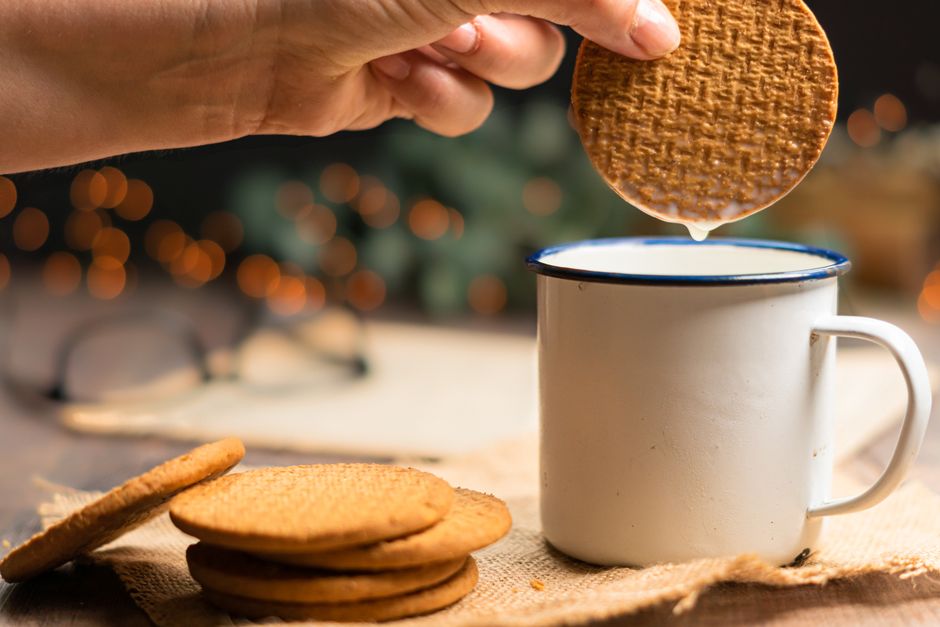 dipping Biscoff cookies in espresso for yogurt tiramisu cups dipping Biscoff cookies in espresso for yogurt tiramisu cups