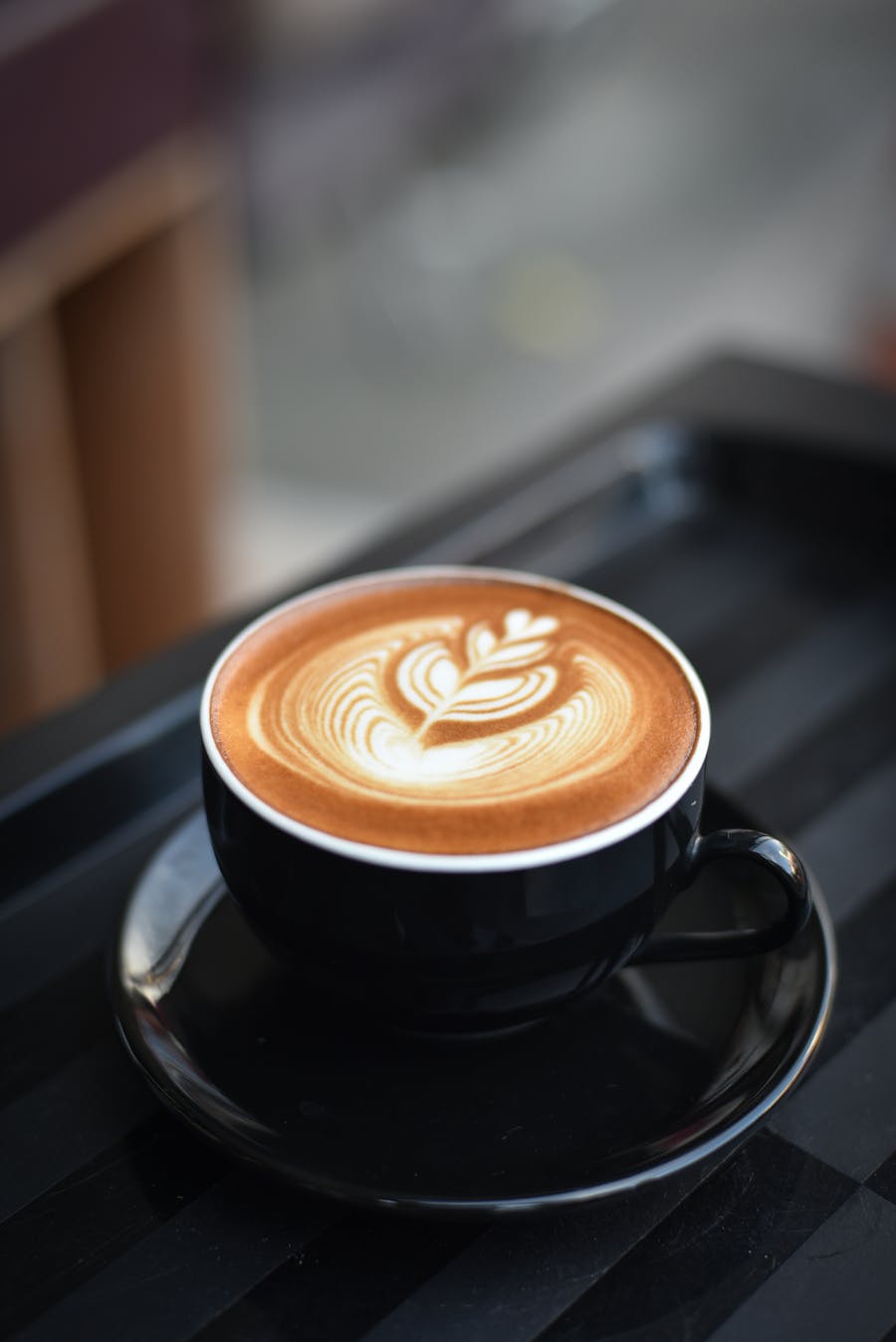 Barista pouring coffee