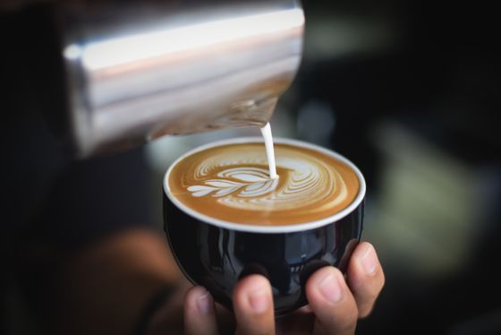 Barista pouring latte art