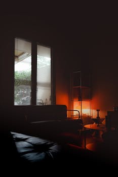 A cozy living room with warm ambient lighting and modern furniture, perfect for relaxation.