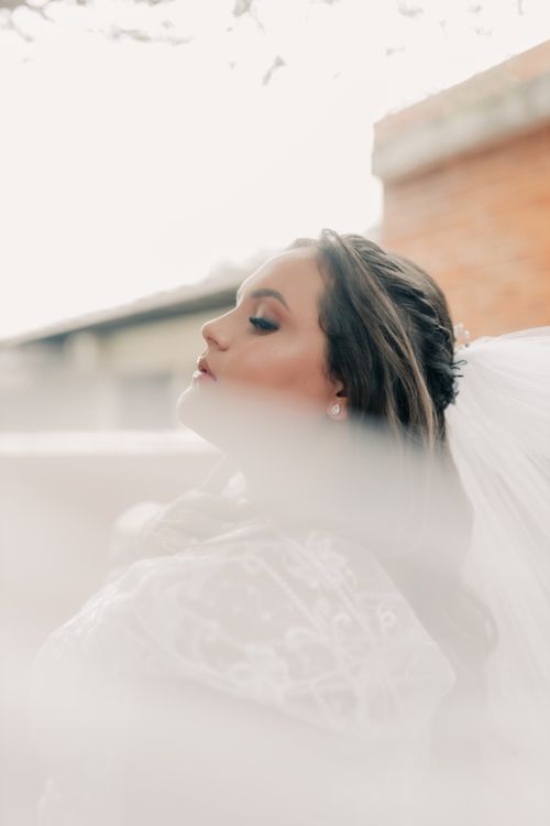 Free A serene bridal portrait with a soft focus veil emphasizing elegance. Stock Photo