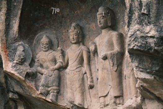 Historic stone carvings depicting Buddhist figures, showcasing ancient religious art.