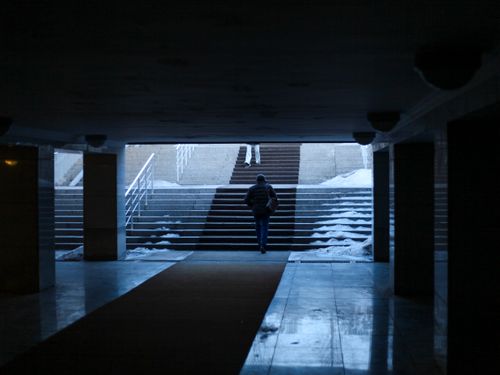 Free A lone figure ascends steps in an underground passage in Astana in winter. Stock Photo