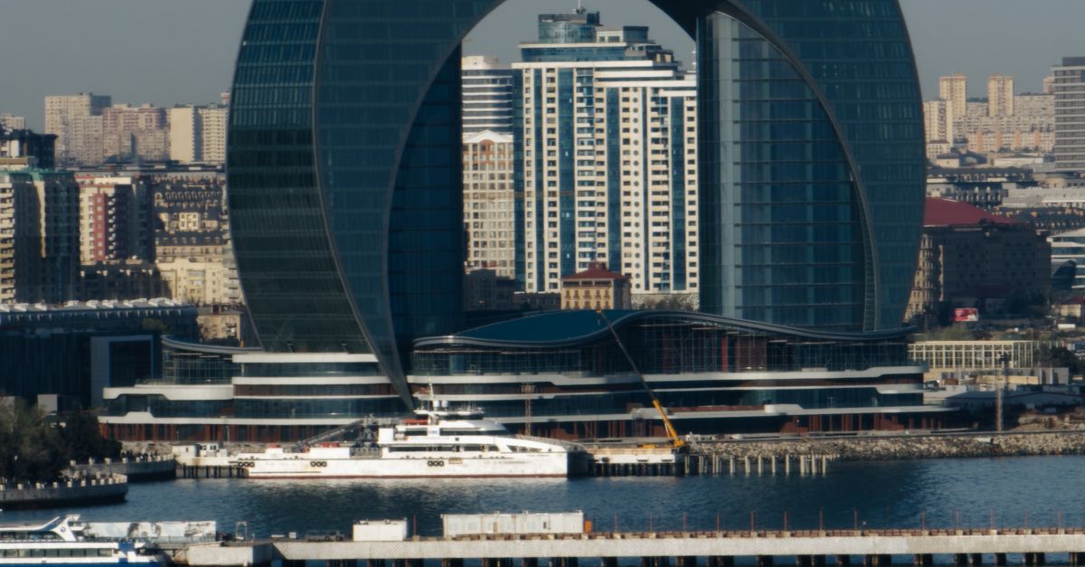 Arc Building Modern Arc Shaped Building by Waterfront · Free Stock Photo