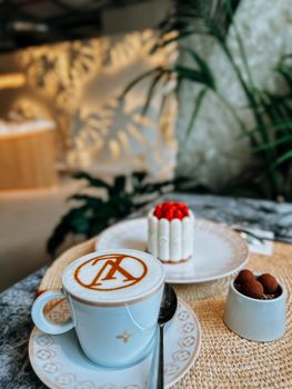 A modern coffee with elegant design and dessert in a chic cafe setting.