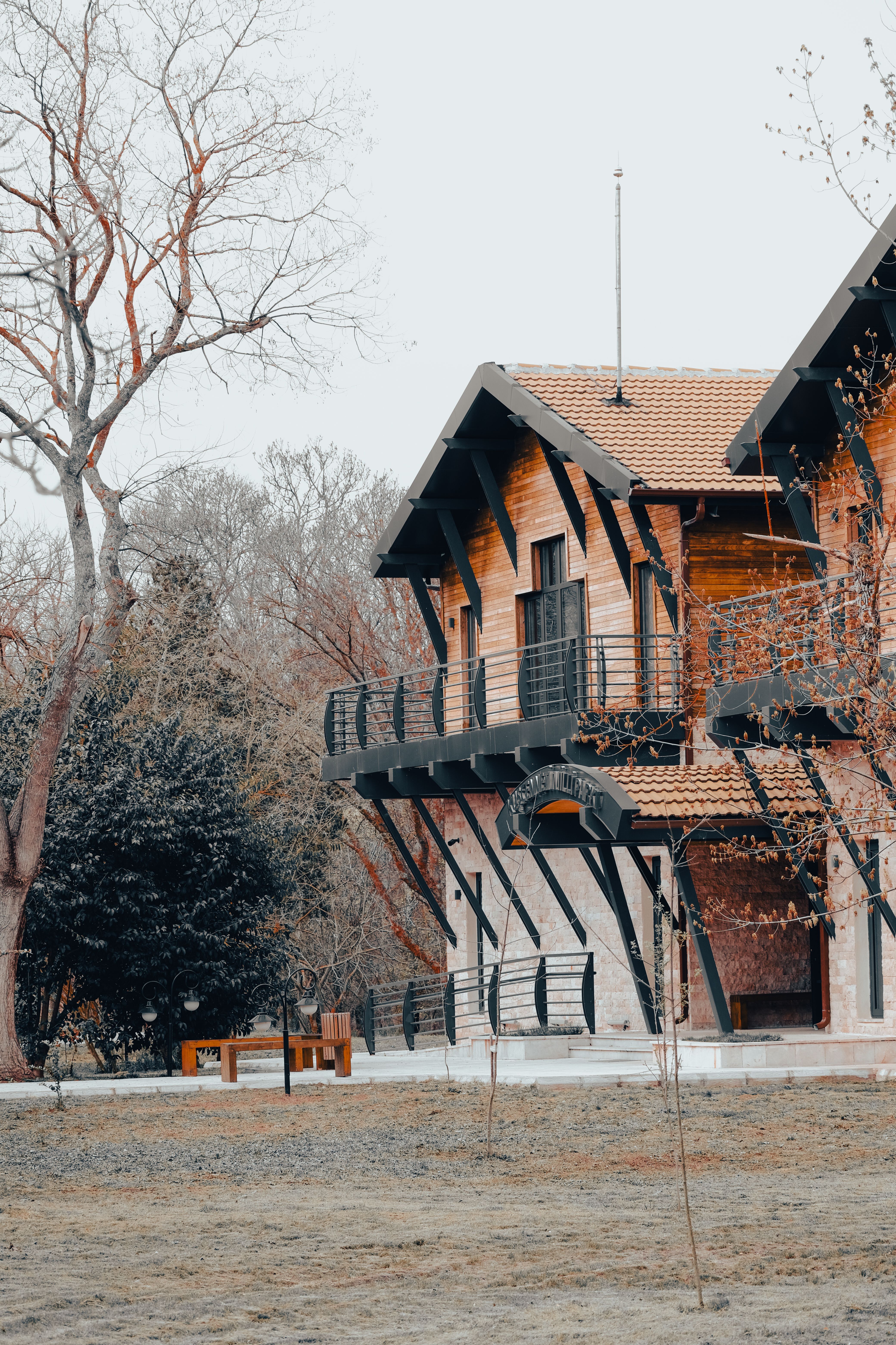 Charming Rustic Wooden House in Forest Setting · Free Stock Photo
