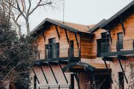 Rustic-style wooden building with modern architecture in a serene national park setting.